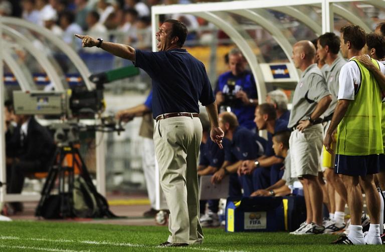 SUWON - JUNE 5:  USA soccer coach Bruce Arena encourages his team as they defeat Portugal 3-2 during the second half during the Portugal v USA, Group D, World Cup Group Stage match played at the Suwon World Cup Stadium, Suwon, South Korea on June 5, 2002. USA won the match 3 - 2. (Photo by Shaun Botterill/Getty Images)