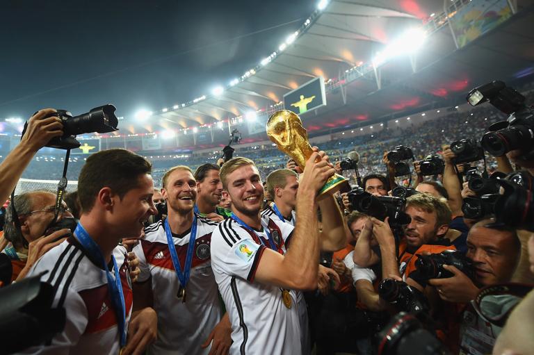 RIO DE JANEIRO, BRAZIL - JULY 13:  Christoph Kramer of Germany celebrates with the World Cup trophy  after defeating Argentina 1-0 in extra time during the 2014 FIFA World Cup Brazil Final match between Germany and Argentina at Maracana on July 13, 2014 in Rio de Janeiro, Brazil.  (Photo by Laurence Griffiths/Getty Images)