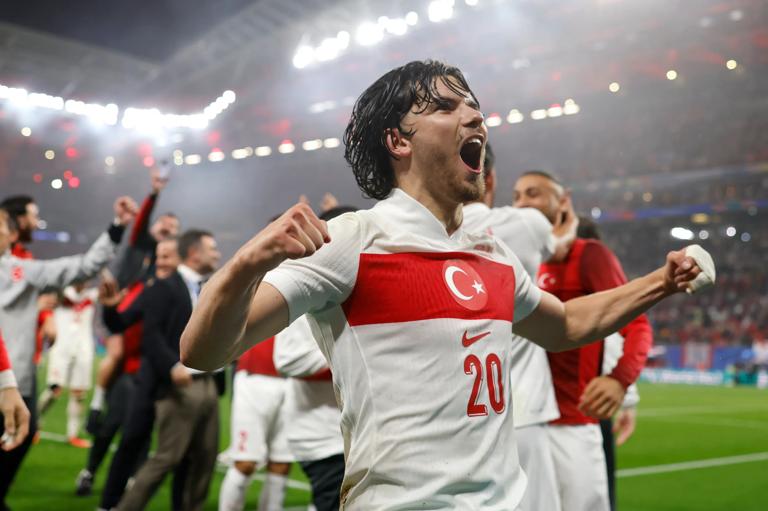 LEIPZIG, GERMANY - JULY 02: Ferdi Kadioglu of Turkey celebrates the 2-1 victory and passage to the quarter finals with teammates and staff following the final whistle of the UEFA EURO 2024 round of 16 match between Austria and Turkiye at Football Stadium Leipzig on July 02, 2024 in Leipzig, Germany. (Photo by Jonathan Moscrop/Getty Images)