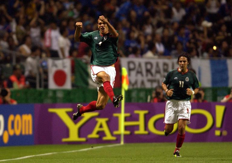 Mexico's Jared Borgetti jumps for joy as he celebrates after scoring the first goal  (Photo by Matthew Ashton/EMPICS via Getty Images)