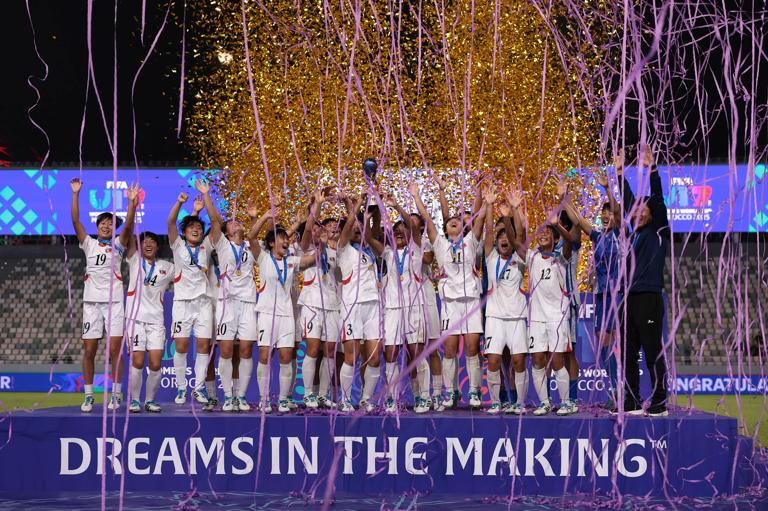 RABAT, MOROCCO - NOVEMBER 08: Jin A Ri, Chong Gum Eh and Rye Yong Pak of Korea DPR lift the FIFA U-17 Women's World Cup Morocco 2025 Trophy following victory in the FIFA U-17 Women's World Cup Morocco 2025 Final match between Korea DPR and Netherlands on November 08, 2025 in Rabat, Morocco. (Photo by Jonathan Moscrop - FIFA/FIFA via Getty Images)